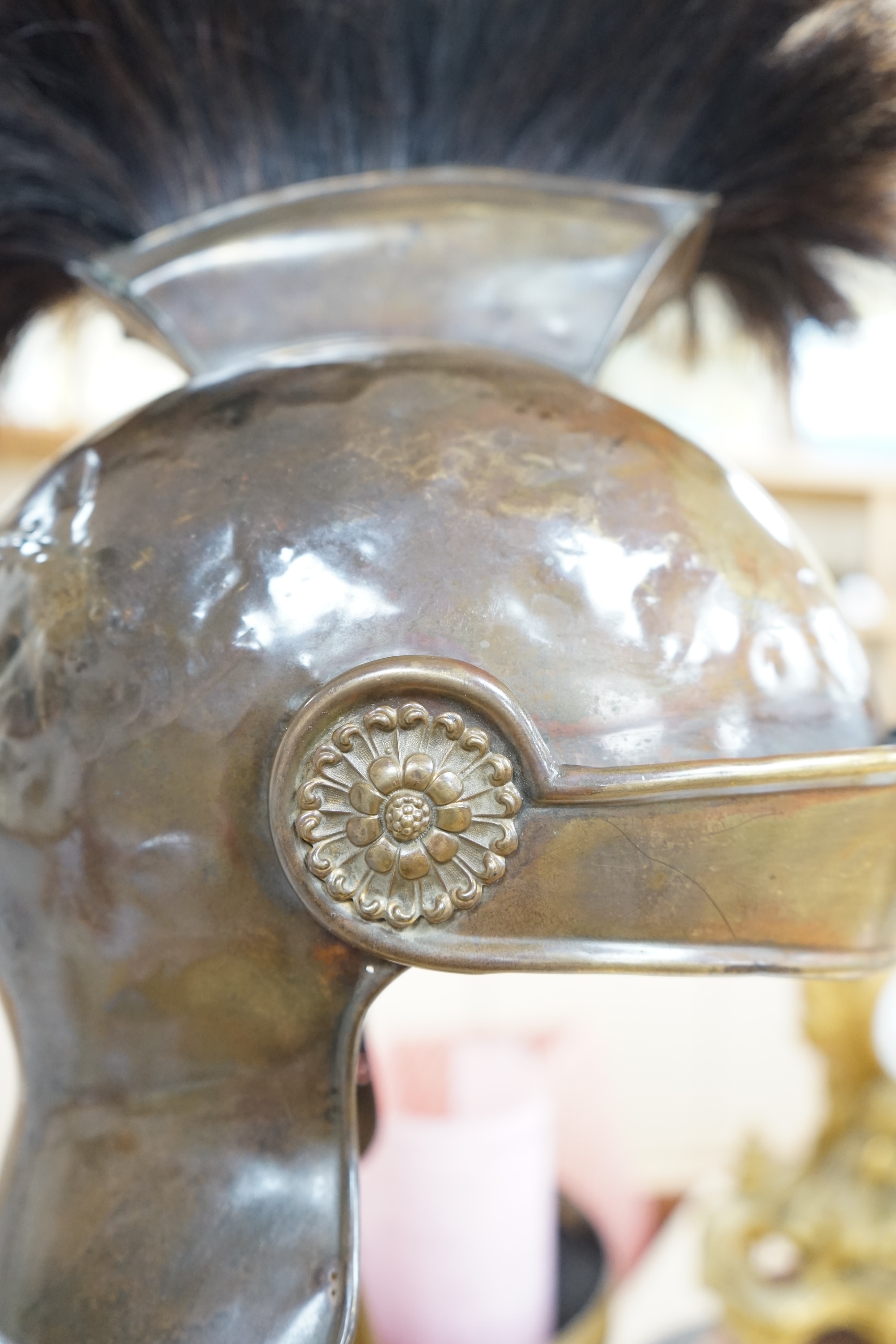 A group of metalware including a Roman style theatrical helmet on stand, a pair of vases and an oil lamp filler, largest 75cm high. Condition - fair to good, lamp filler in antique condition